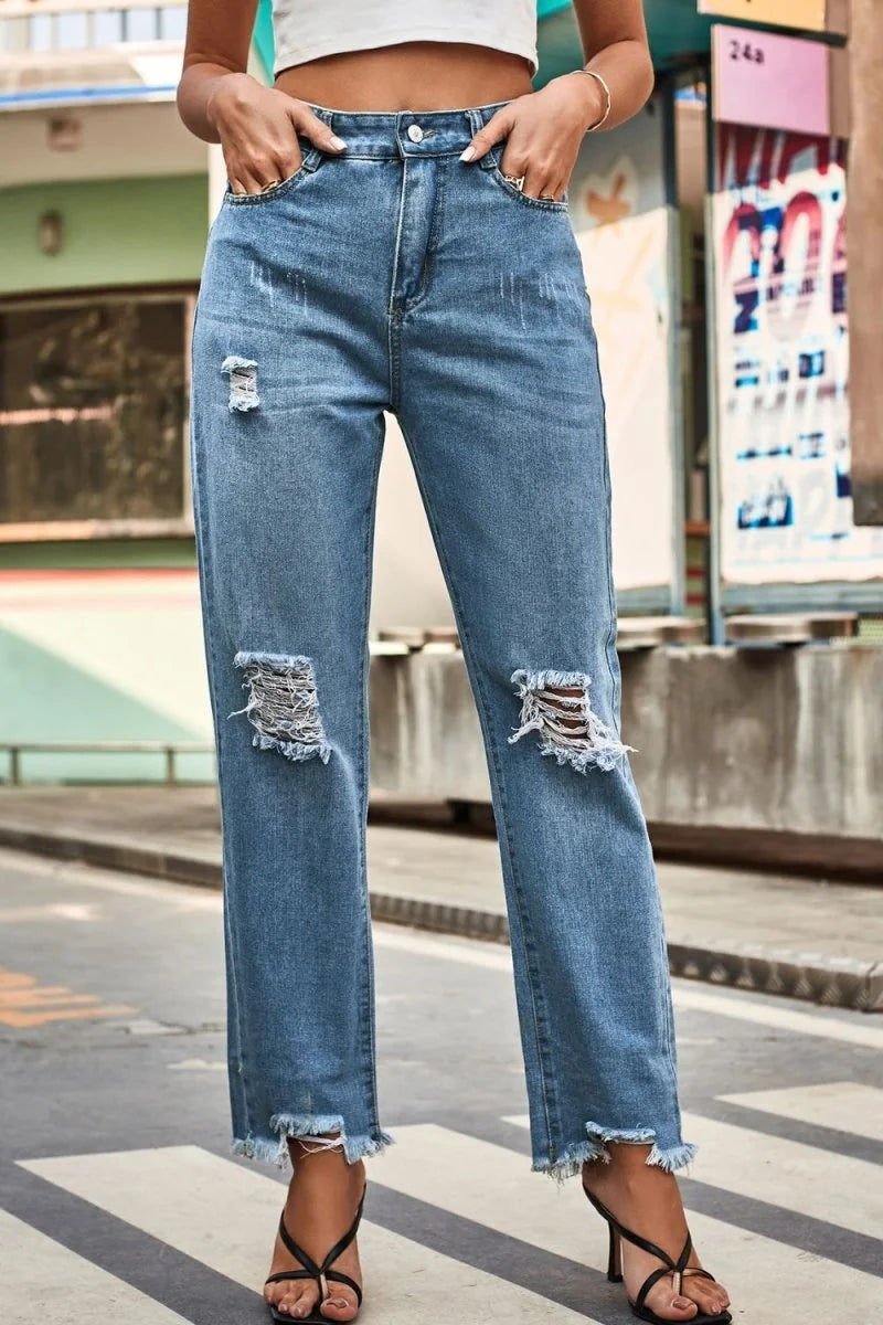 Medium wash distressed buttoned loose fit jeans