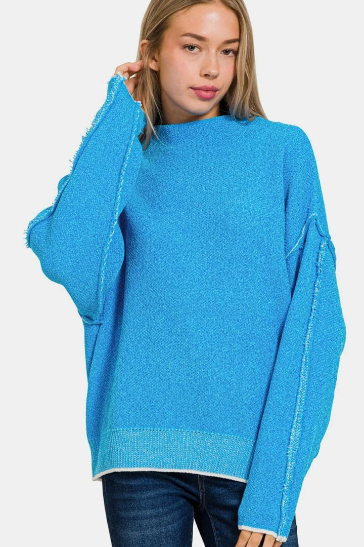Deep Sky exposed seam mock neck sweater
