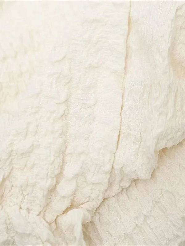 Women's cream asymmetric top and high waist pants suit