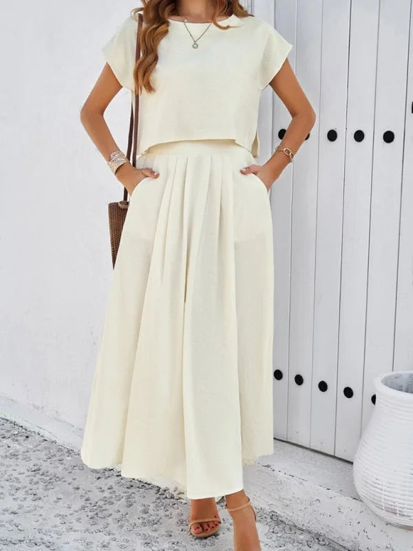 Cream sleeveless top and long skirt suit