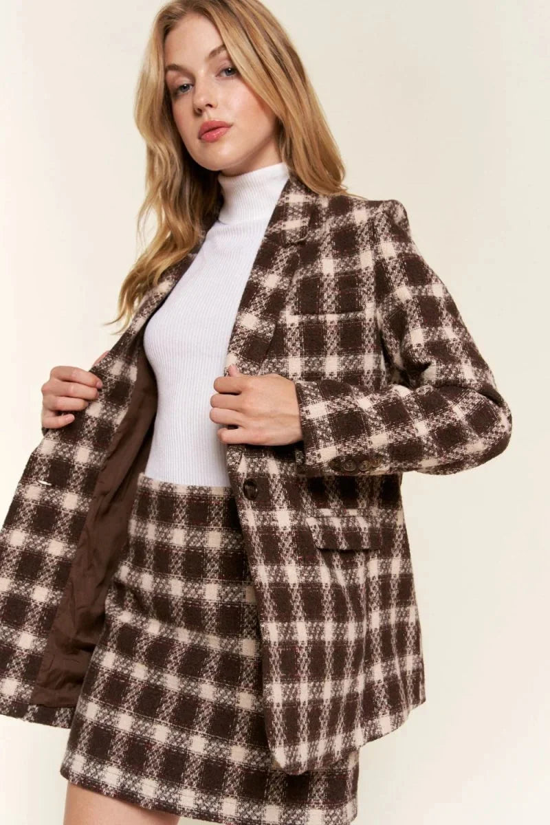 Brown and cream brushed plaid blazer with a fitted silhouette and button details, worn by a model.