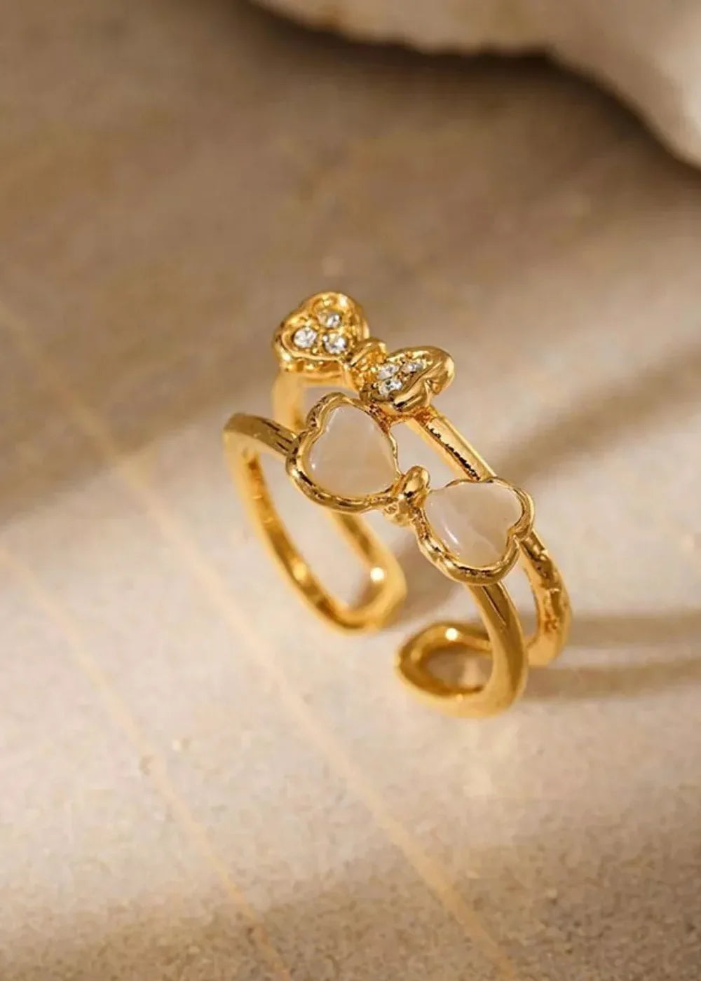 Gold plated bow open ring with resin and rhinestones