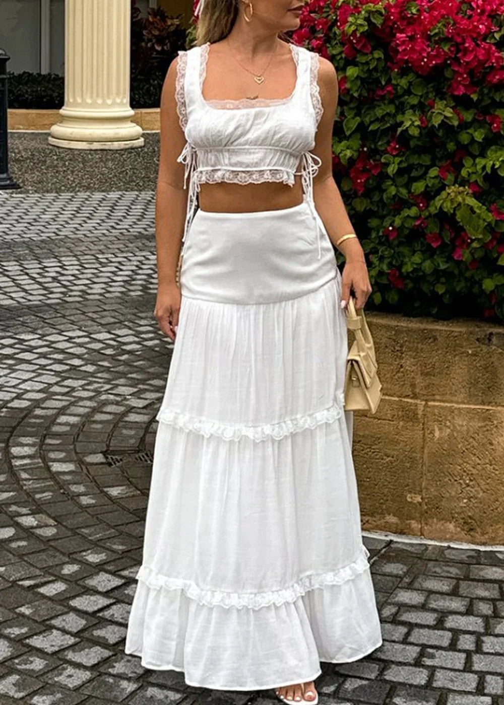 White fashion suit with lace up top and long skirt