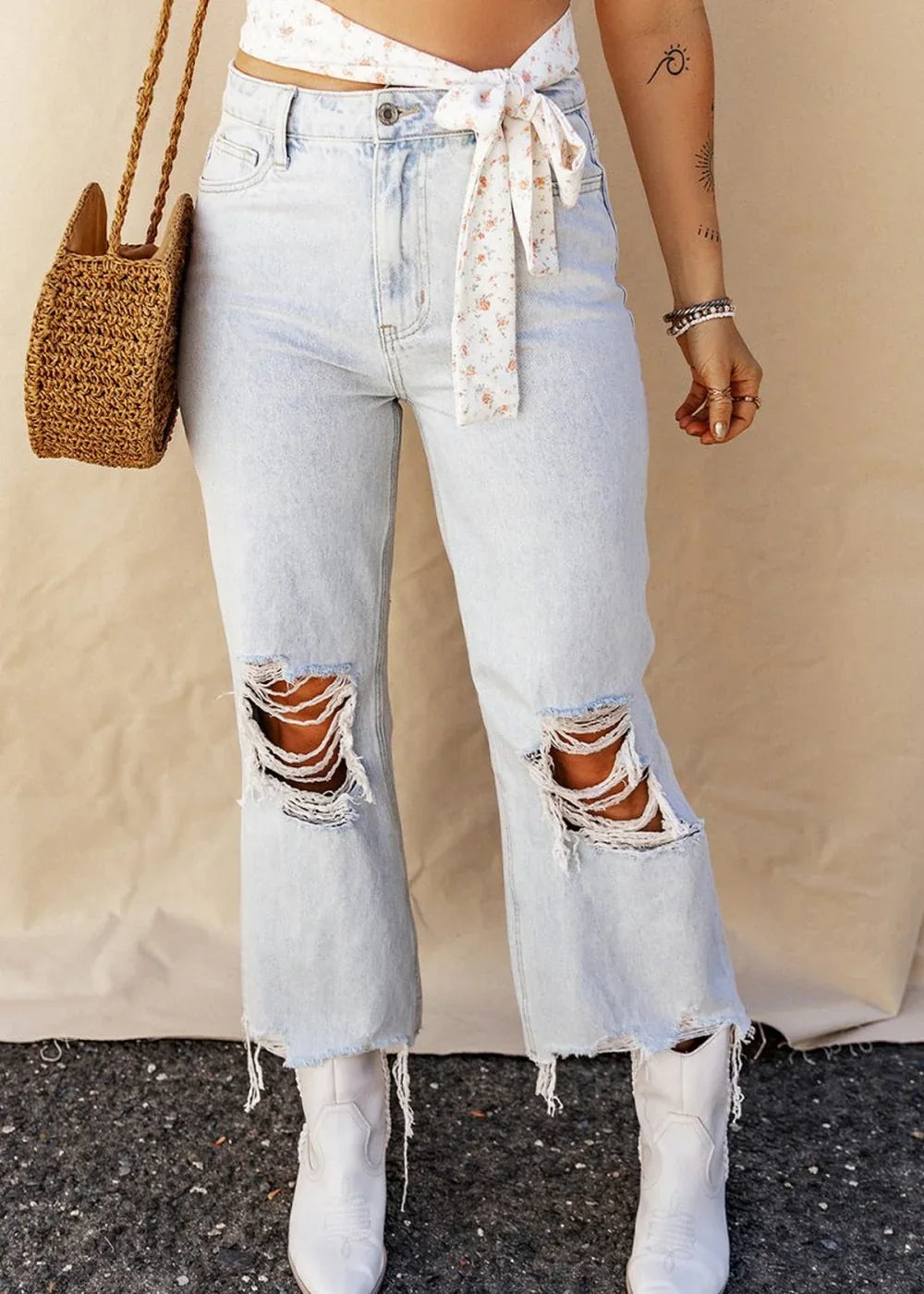 Light wash distressed raw hem denim jeans with pockets