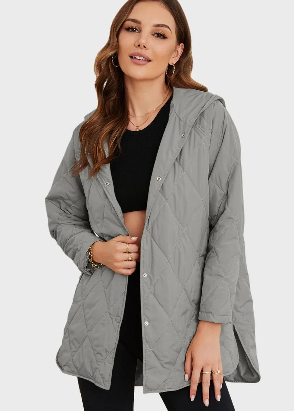 Quilted gray polyester jacket with hood and snap closures, worn by a woman with gold jewelry.