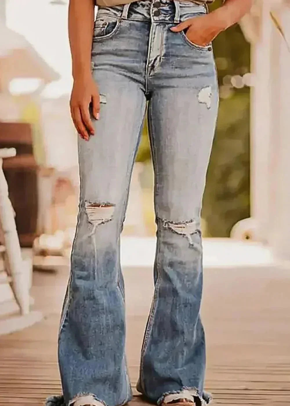 Light wash distressed raw hem bootcut jeans