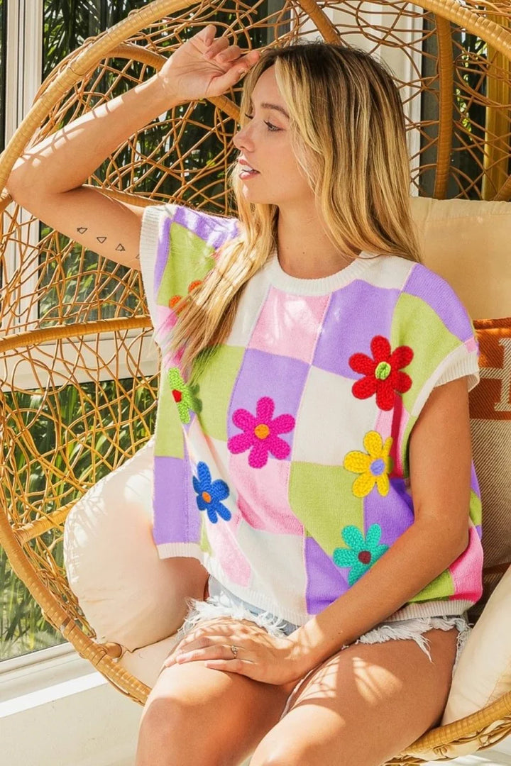 Lavender, blush, and lime checkered sweater vest with flower patches