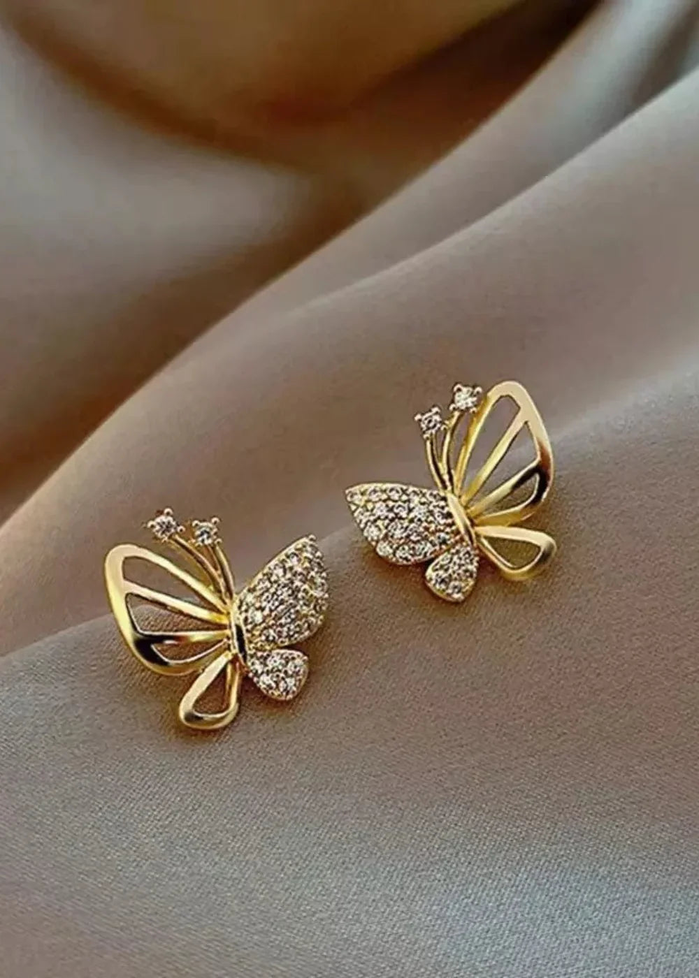 Gold plated alloy butterfly stud earrings with rhinestones