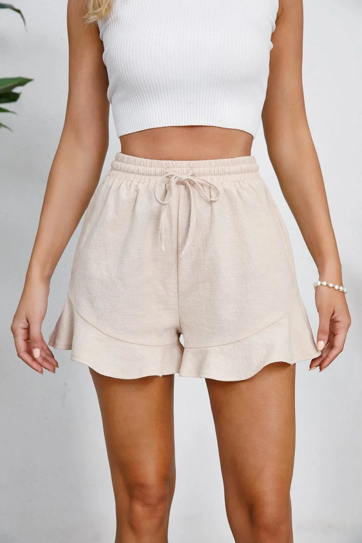 Sand colored cotton shorts with ruffle hem
