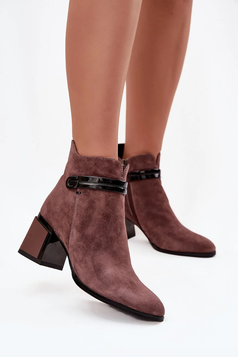 Brown suede ankle boots with decorative strap