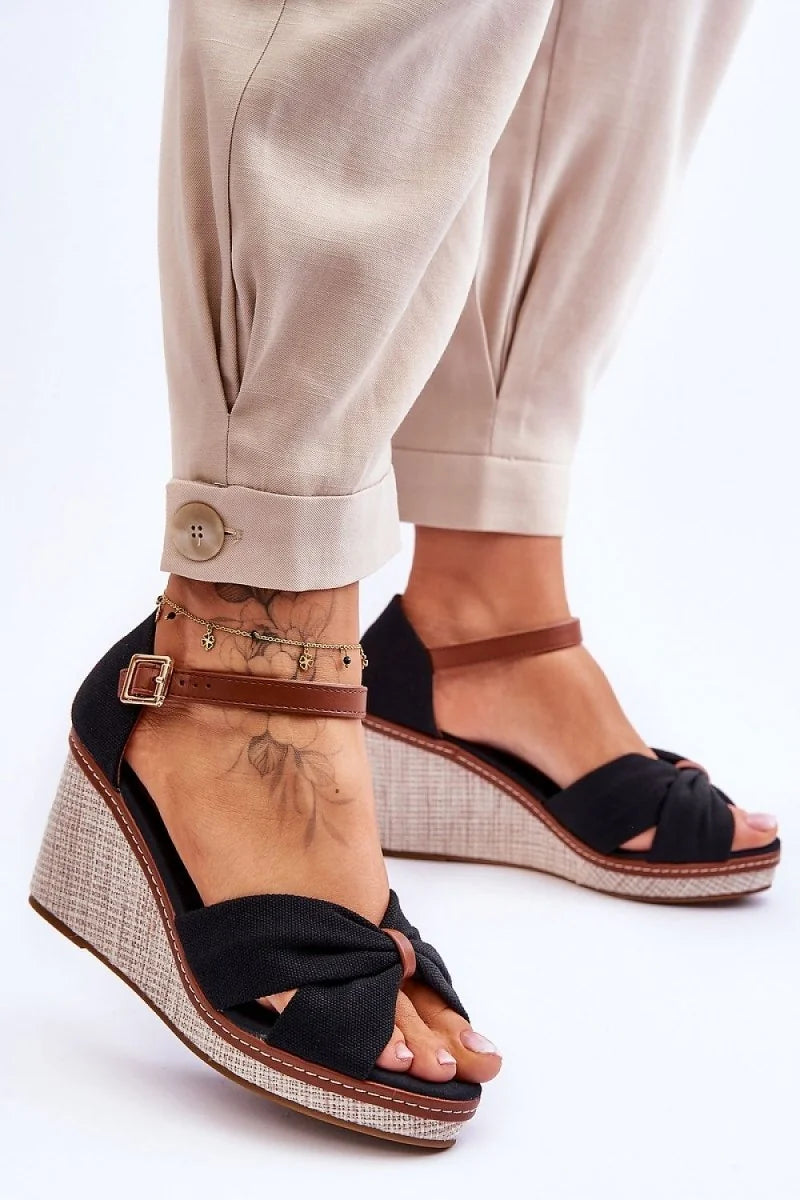 Black heeled sandals with buckle strap