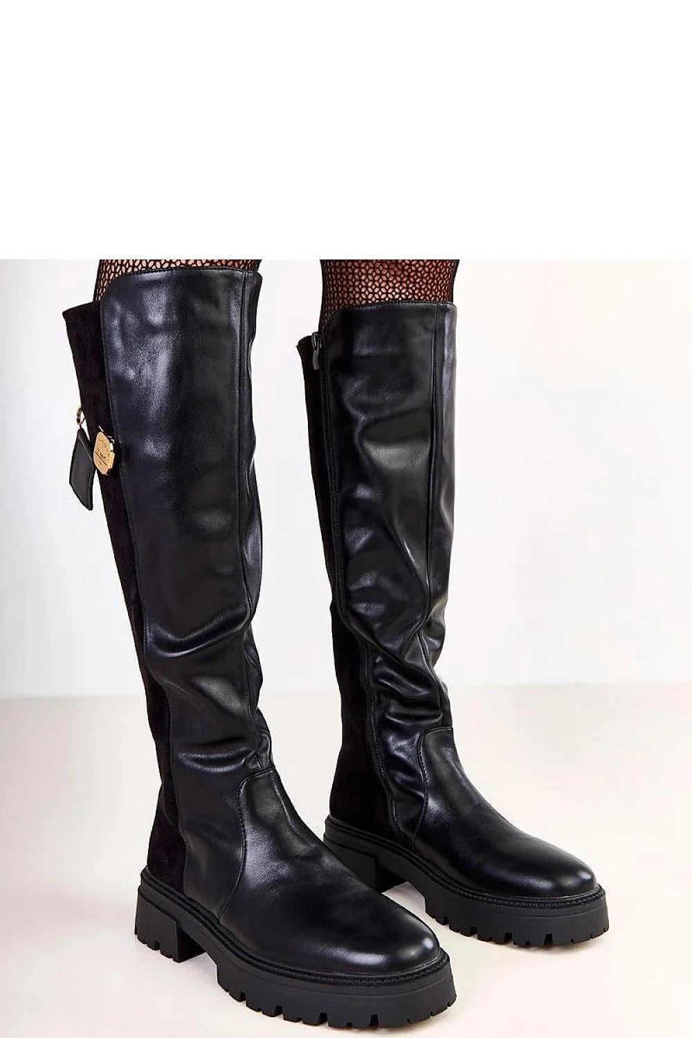Black thigh-high boots with gold clasp detail