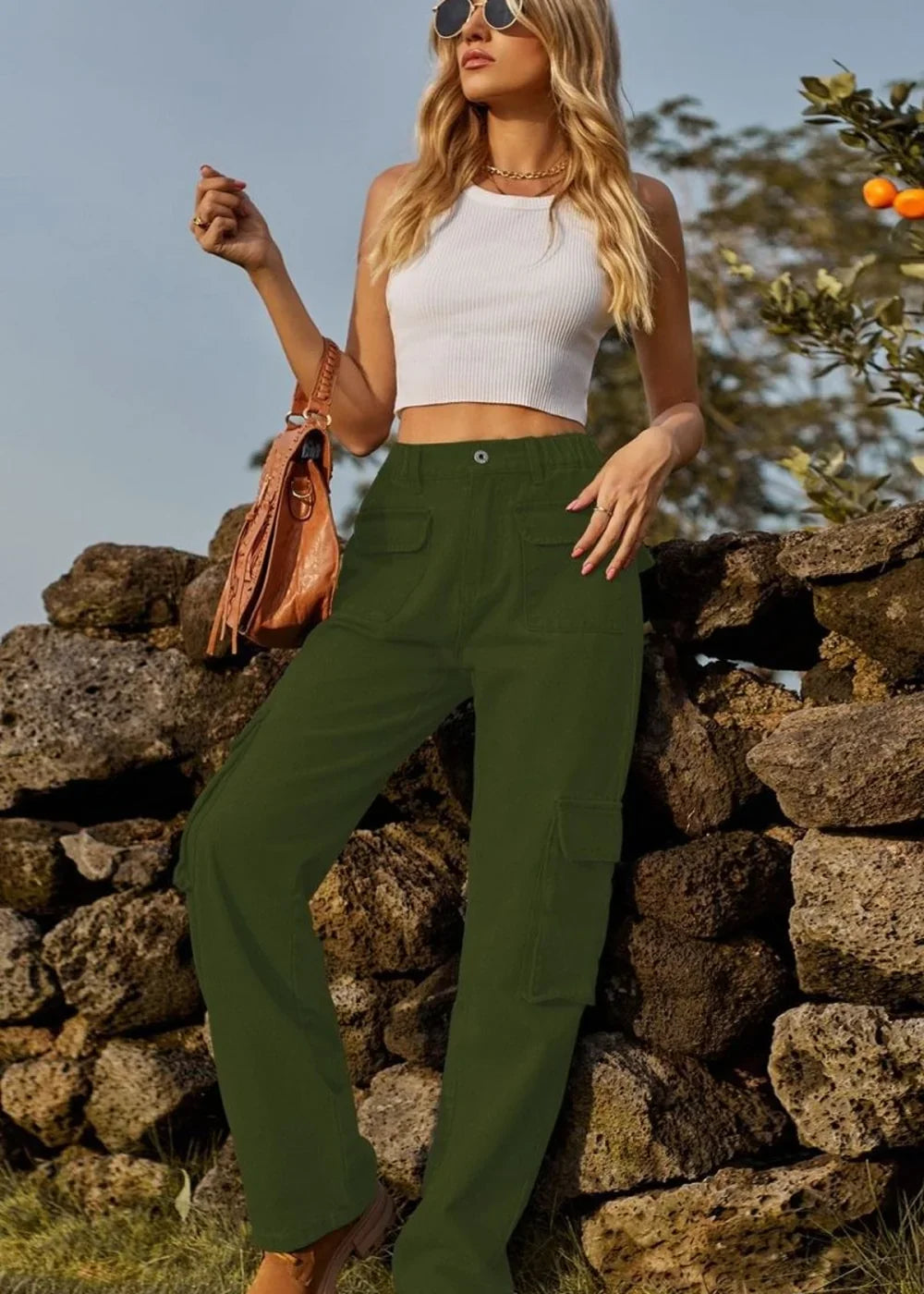 Green cargo pants with multiple pockets shown on a model.