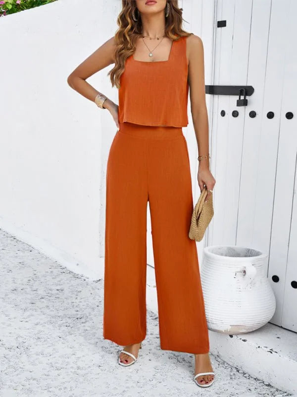 Orange linen-look sleeveless crop top and wide-leg pants set on a woman with white sandals.