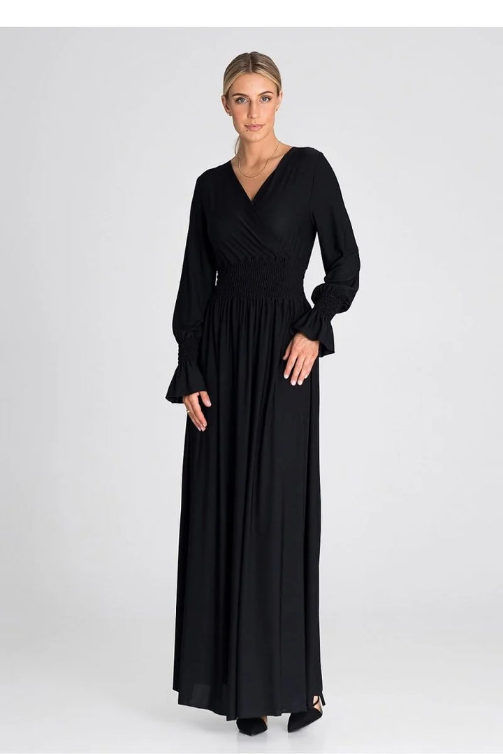 Black long-sleeved maxi dress with a cinched waist and ruffled cuffs.