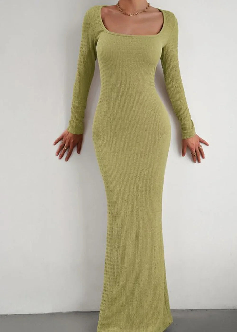 Lime green ribbed knit maxi dress with square neckline and long sleeves, fitted on model.