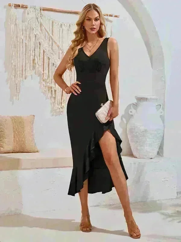 Black V-neck midi dress with ruffled high-slit hem and rhinestone embellishment, on model.