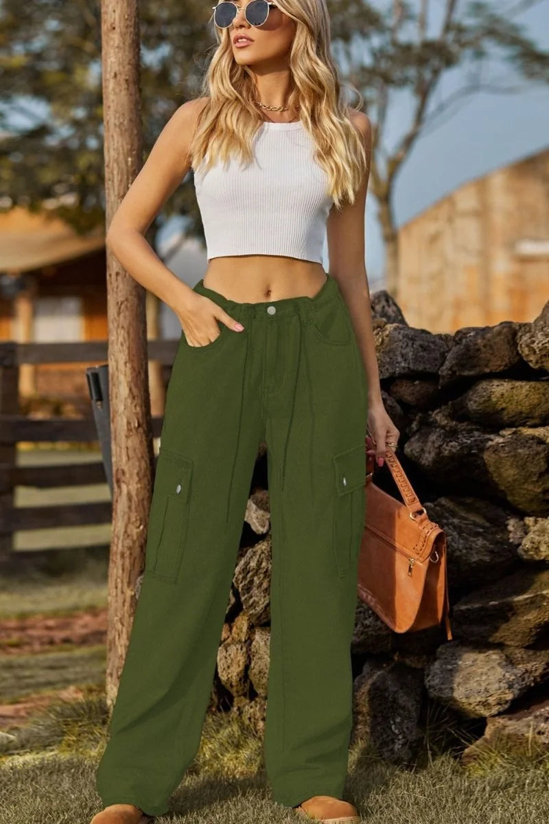 Green cargo pants with a regular fit, featuring pockets on the legs and a textured drawstring waist.