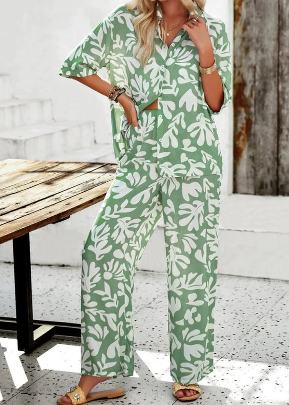 Green and white abstract print viscose wide-leg pants, true to size, on model.