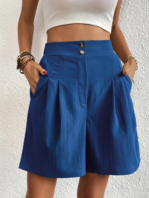 Blue culottes with a textured fabric, high waist, and two button closure.