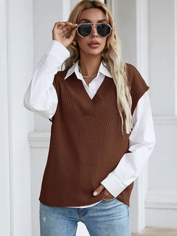 Brown knitted v-neck sweater vest over a white collared shirt, worn by a model with sunglasses.