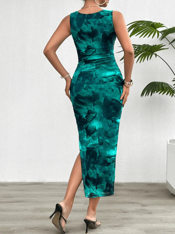 Emerald and dark green tie-dye print sleeveless maxi dress with a thigh-high slit, worn by a model.