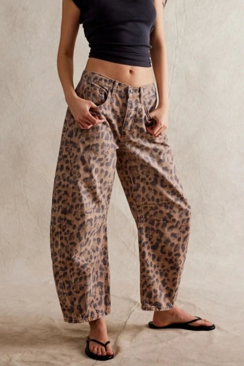 Relaxed fit, leopard print jeans on model, featuring a brown and black spotted pattern.