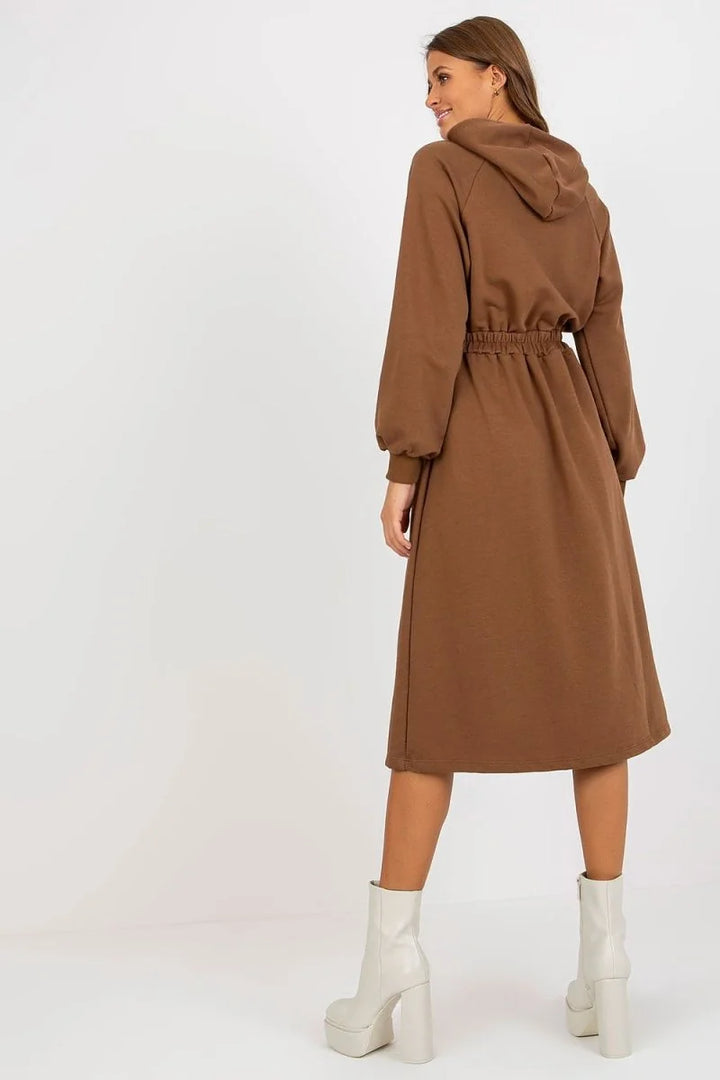 Brown hooded midi dress with cinched waist and white platform boots on model.
