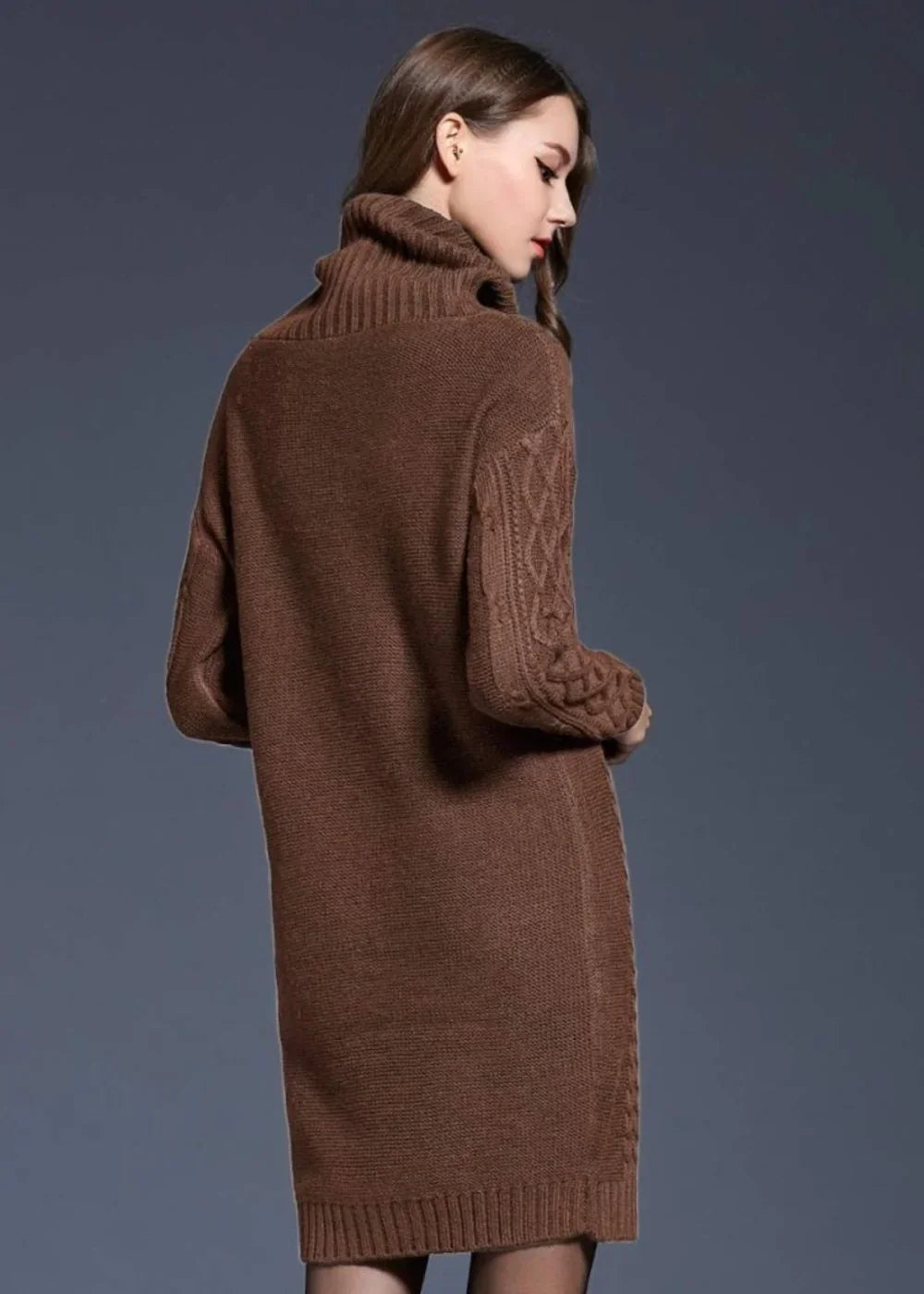 Brown knit turtleneck sweater dress with cable knit sleeves on a model.