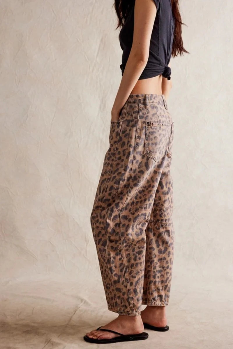 Relaxed fit, tan and black leopard print denim pants with a cropped hem on model.