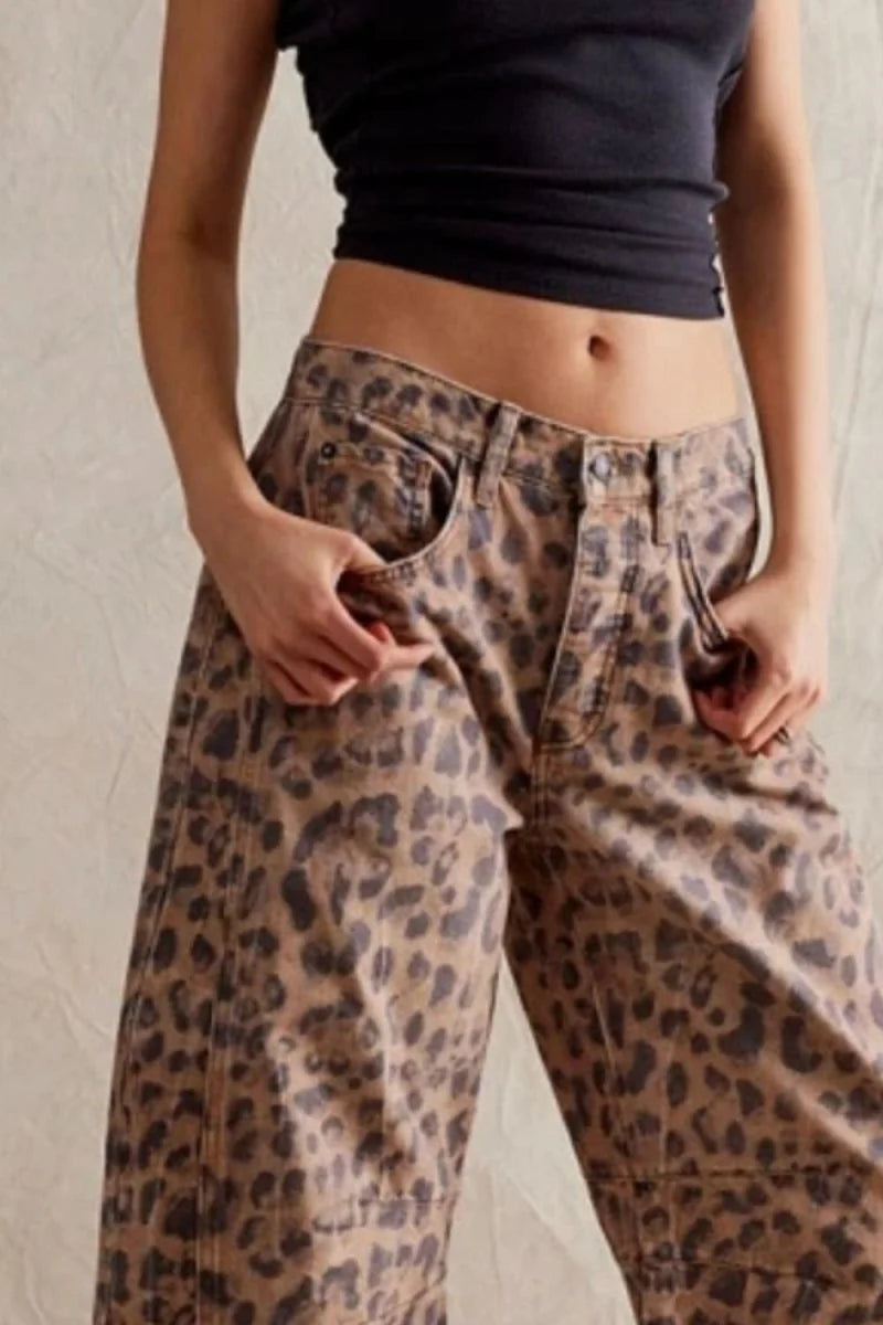Relaxed fit, tan and black leopard print denim pants on model.