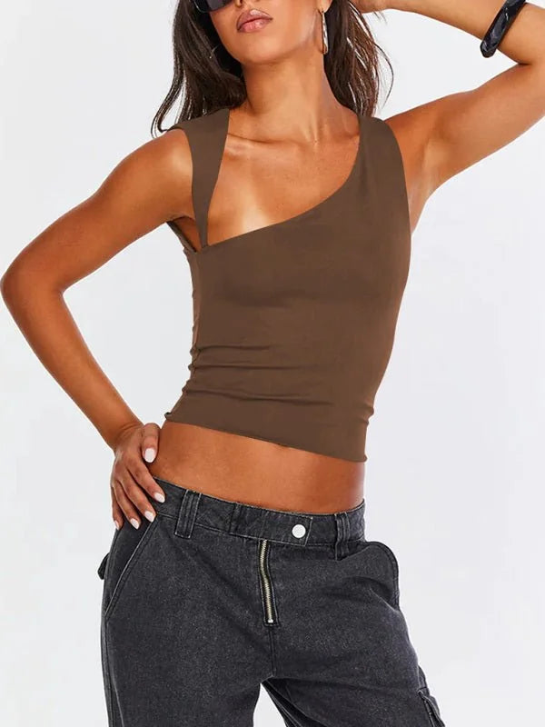 Brown one-shoulder crop top with a cutout detail and black cargo pants on a model.