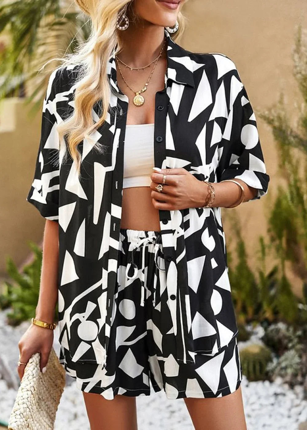 Black and white abstract print viscose short suit with drawstring shorts on model.