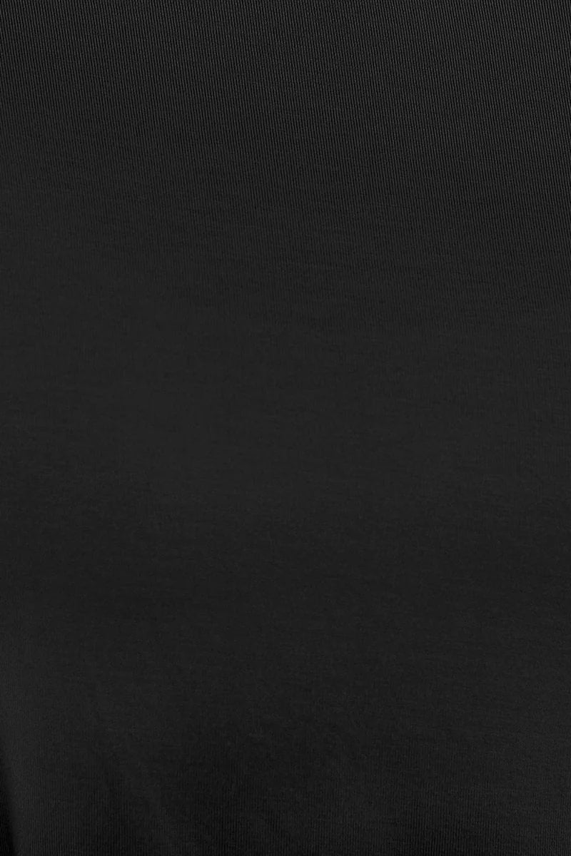 Close-up of black ribbed fabric with a subtle sheen.