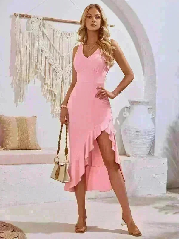 Pink ruffled asymmetrical midi dress with V-neck, worn by a model.