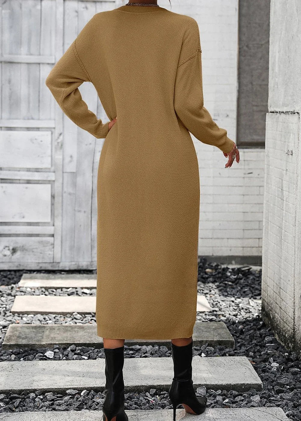 Back view of a brown, long-sleeved, textured knit midi dress on a model wearing black boots.