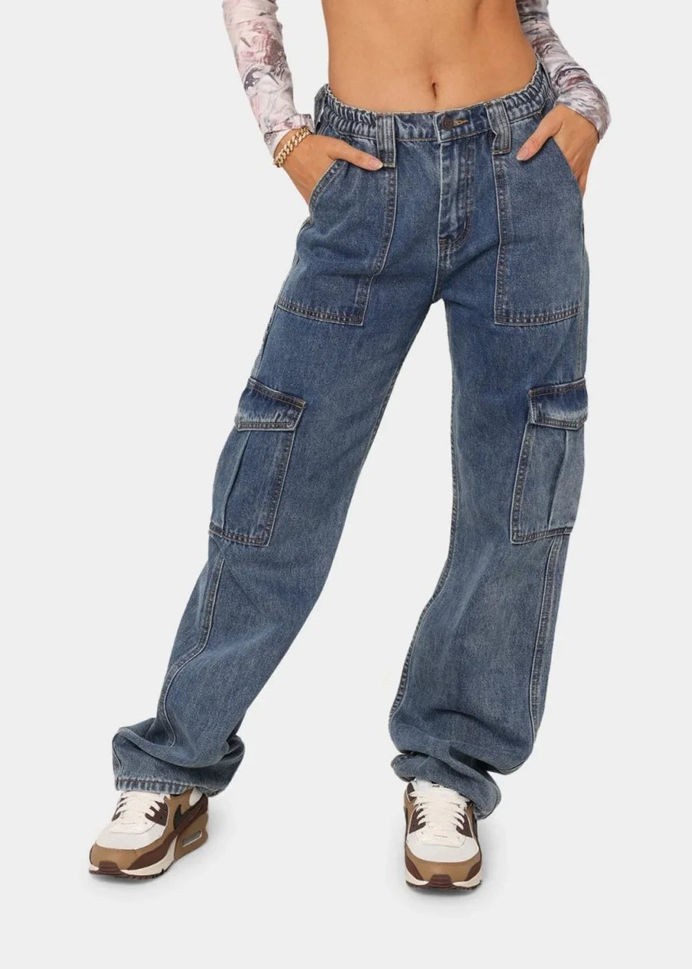 Blue denim cargo pants with a regular fit and multiple pockets, worn on a model.
