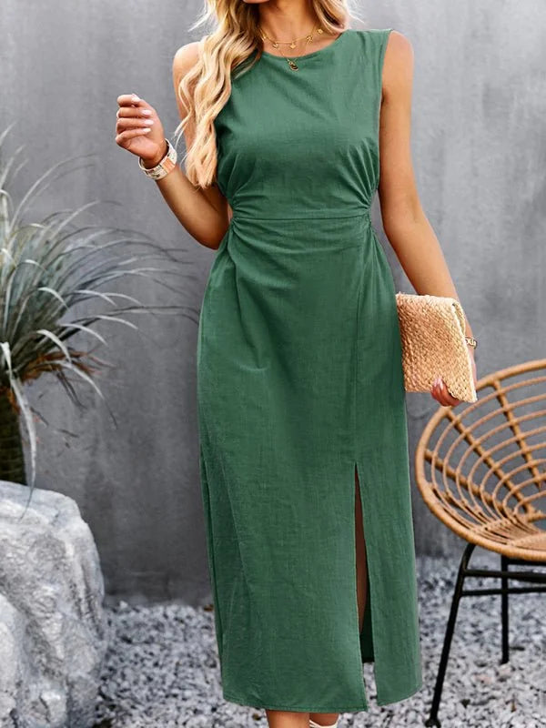 Emerald green sleeveless midi dress with a side slit and cinched waist.