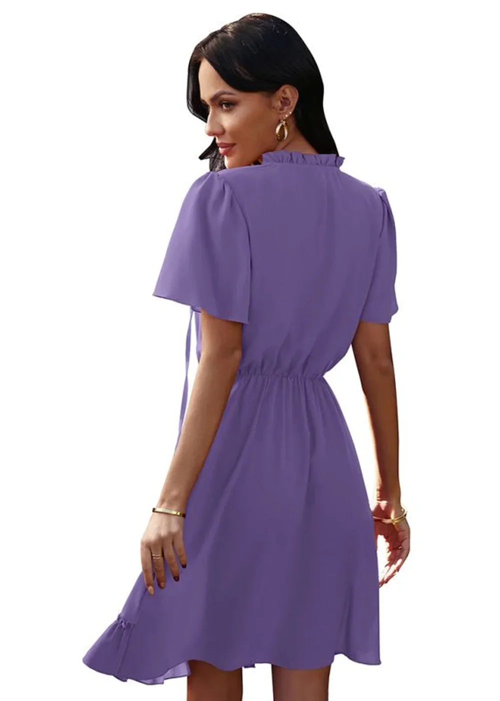 Purple short-sleeve dress with ruffled neckline and cinched waist, shown from the back.