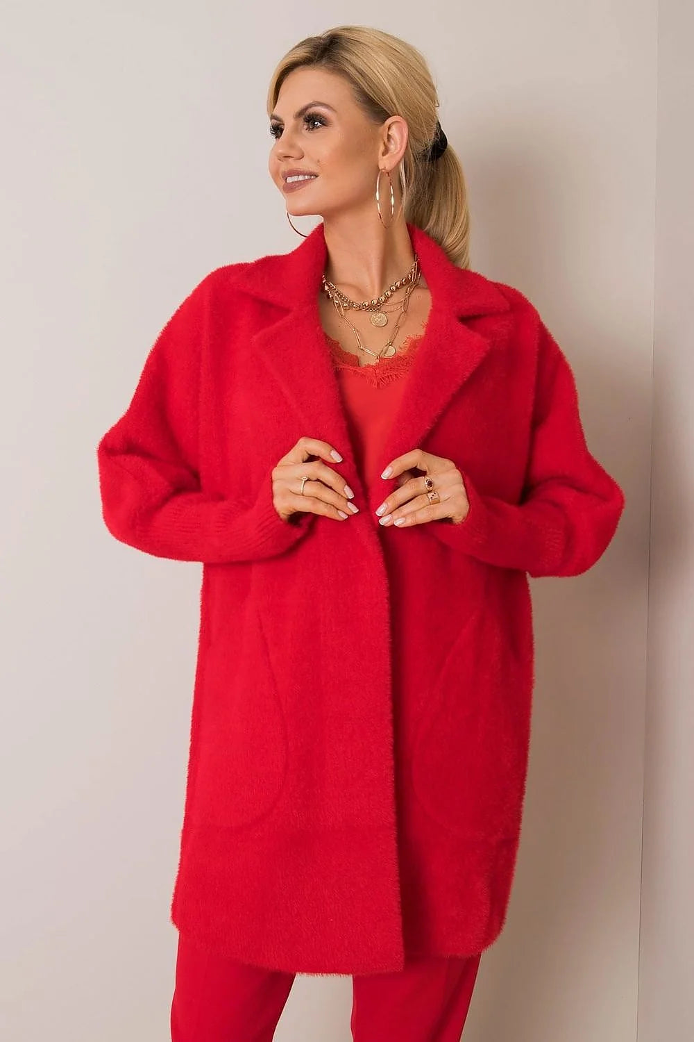 Red fuzzy angora blend coat with lapel collar and deep pockets, worn by a model.