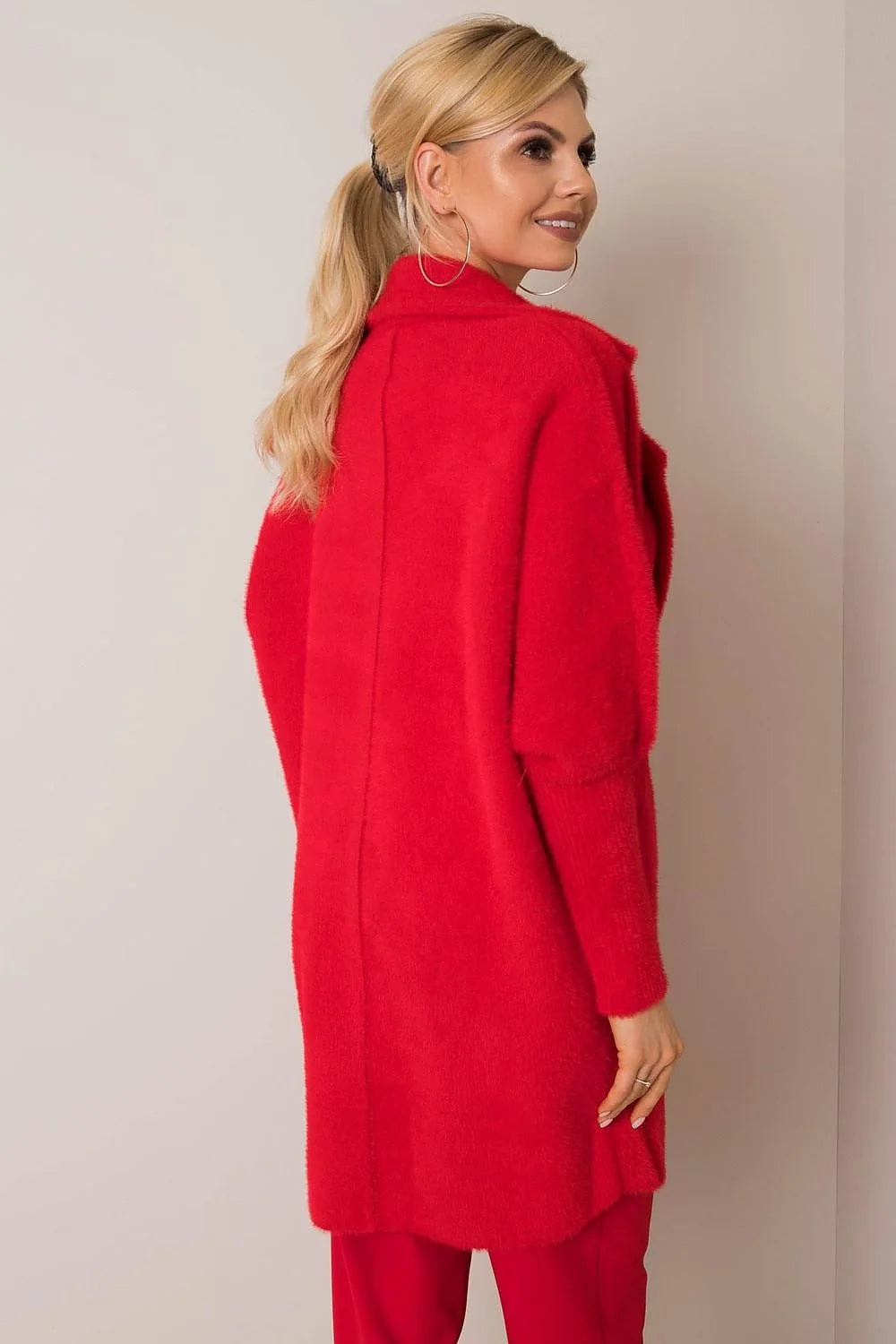 Red fuzzy angora blend cardigan with long sleeves, worn by a woman.