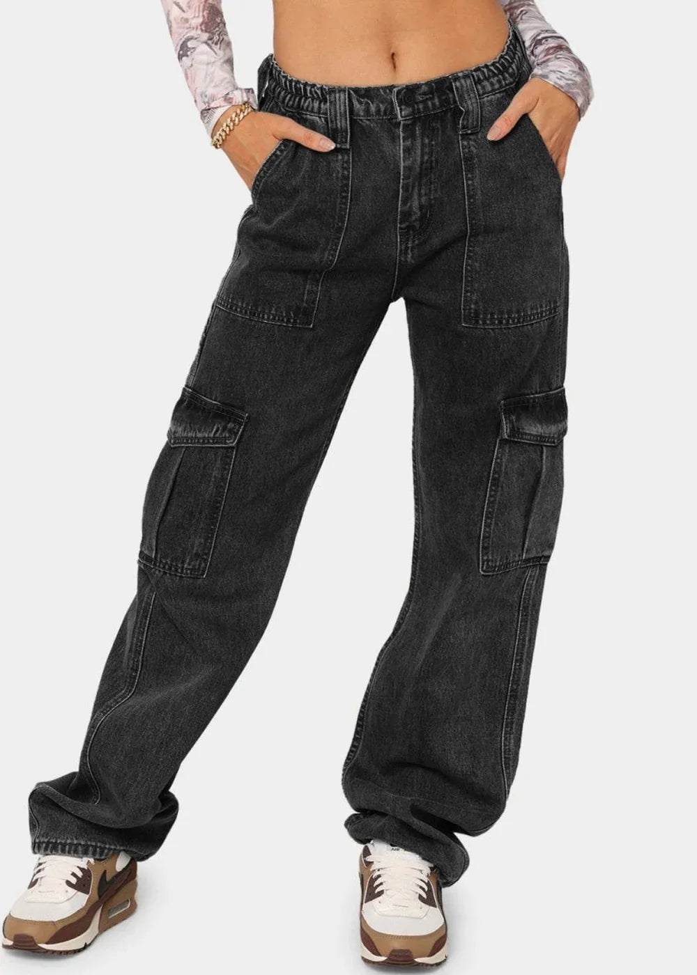 Charcoal gray cargo jeans with multiple pockets and a relaxed fit, shown on a model.
