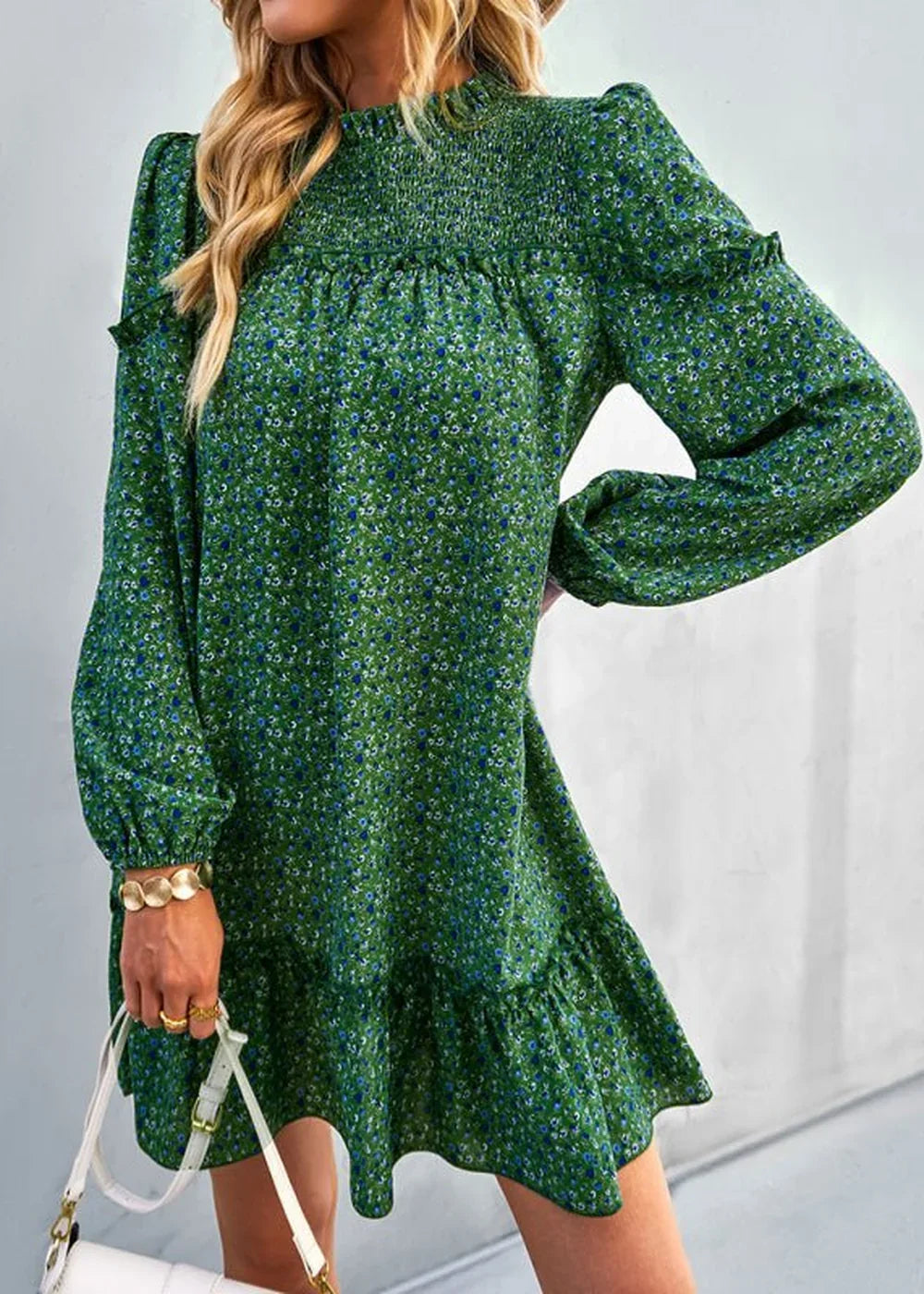 Green floral print day dress with smocked bodice and ruffled hem.