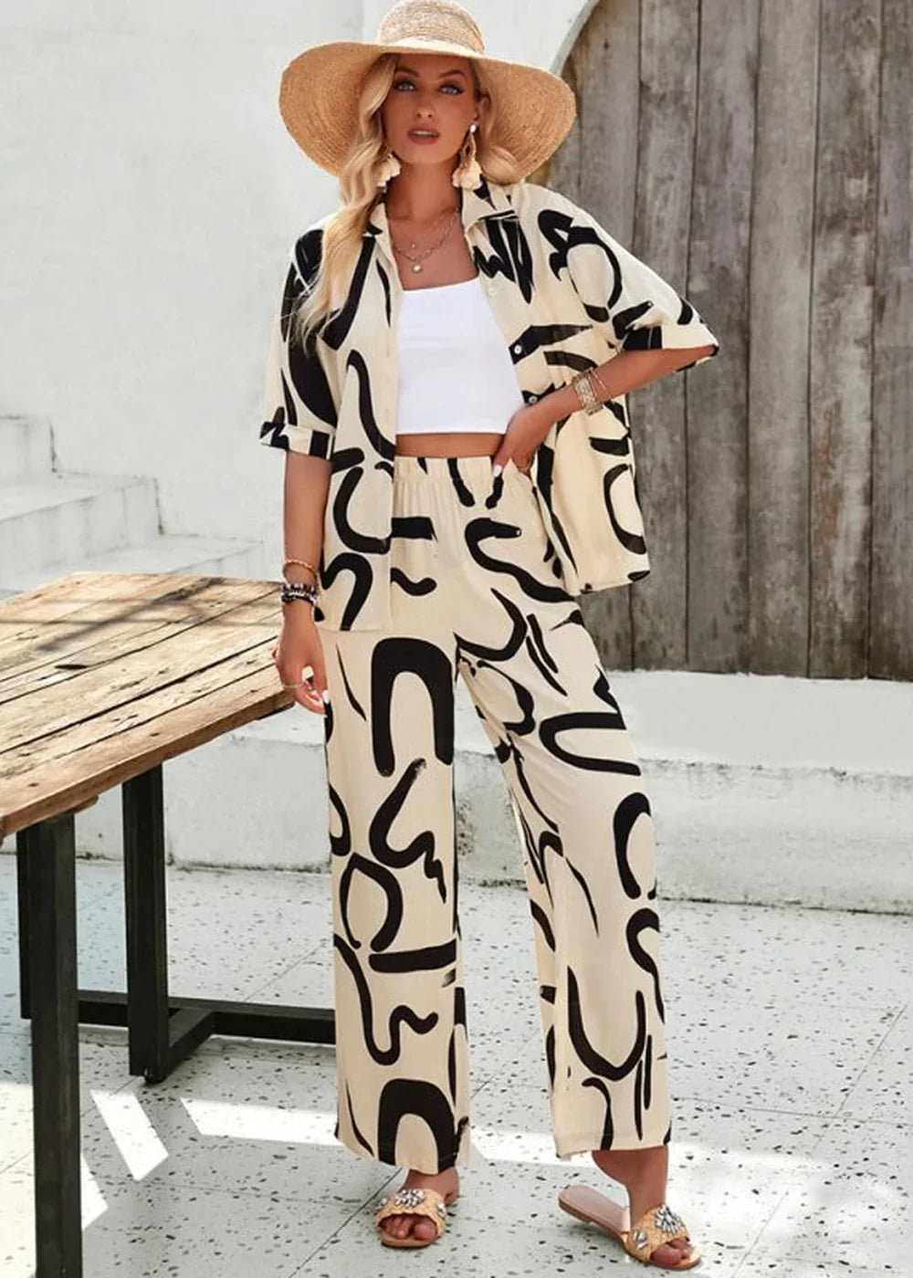 Champlain colored wide-leg pants with abstract black print, on model
