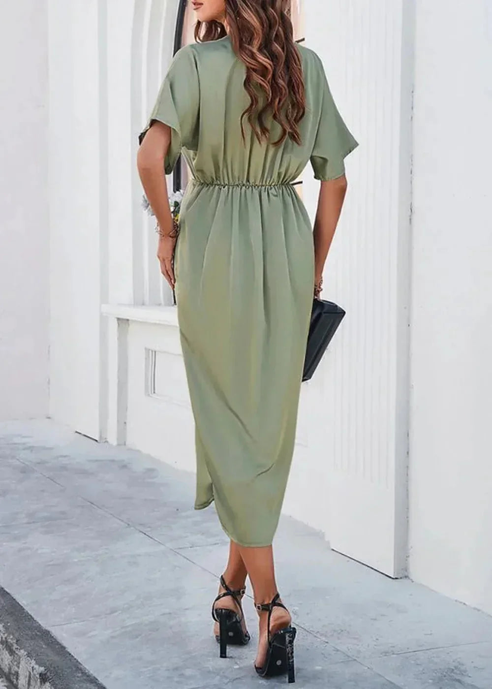 Model wearing a green V-neck midi dress