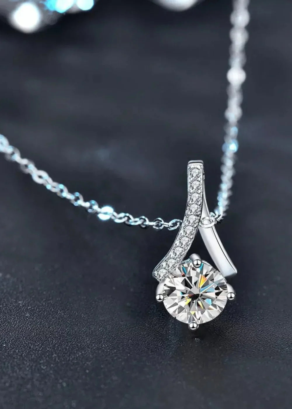 Close-up of the moissanite stone on a sterling silver chain