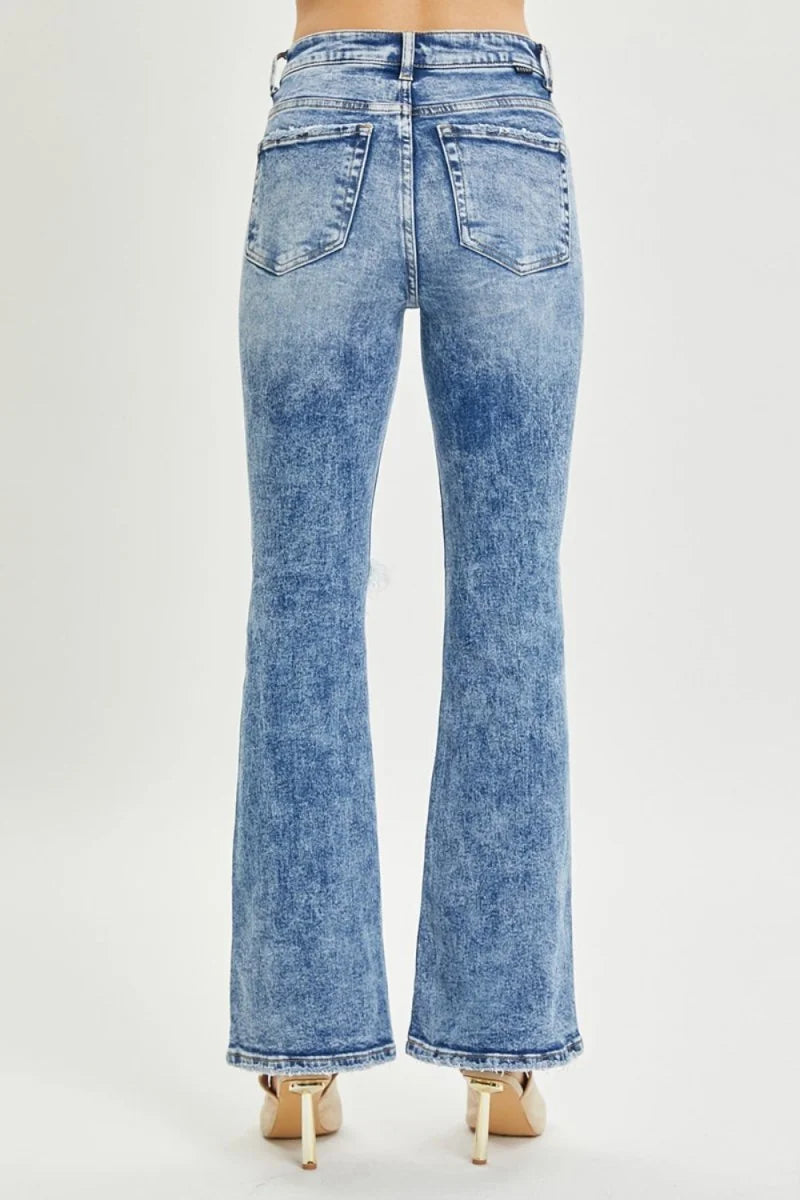 Close-up of distressed detail on flare jeans