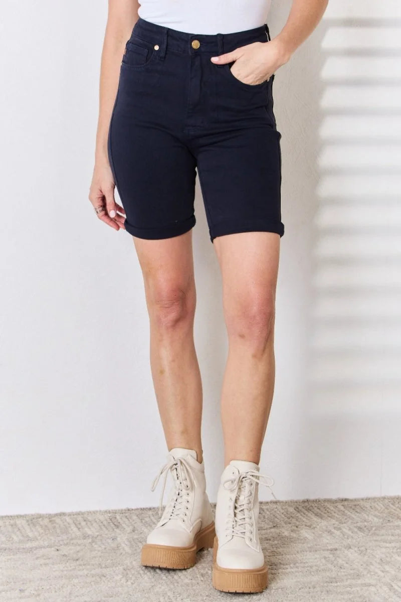 Navy blue cotton blend shorts with a regular fit, cuffed hems, and gold button detail.