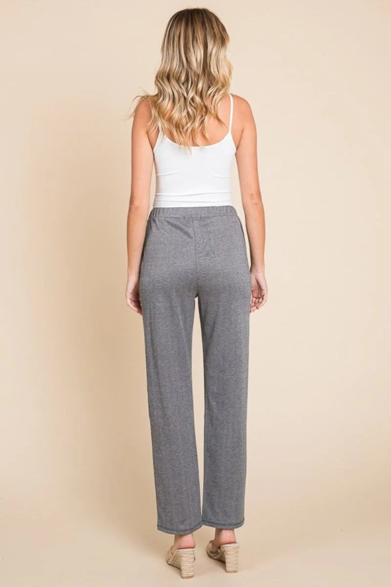 Close-up of pintuck detail on trousers
