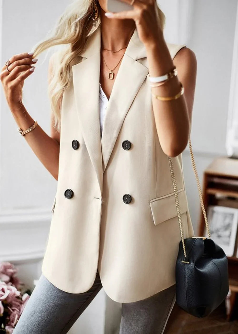 Cracker khaki sleeveless double-breasted blazer with black buttons on model